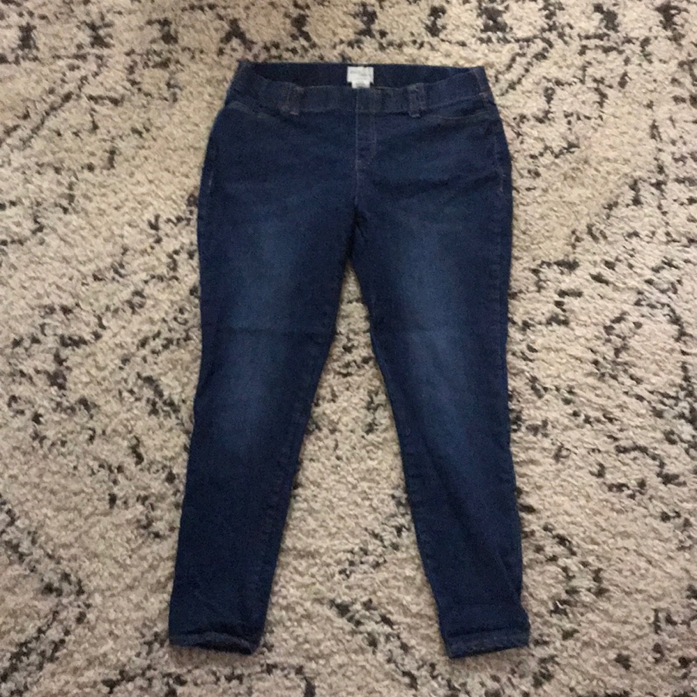 A pair of jeans and leggings